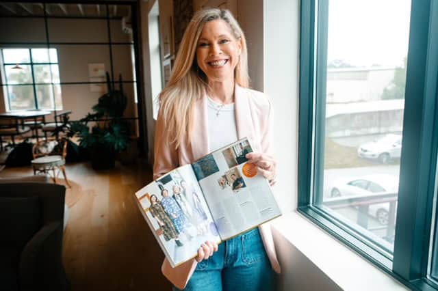 Angel Holmes, business mentor for women solopreneurs, demonstrating time management tips at organized Charleston workspace