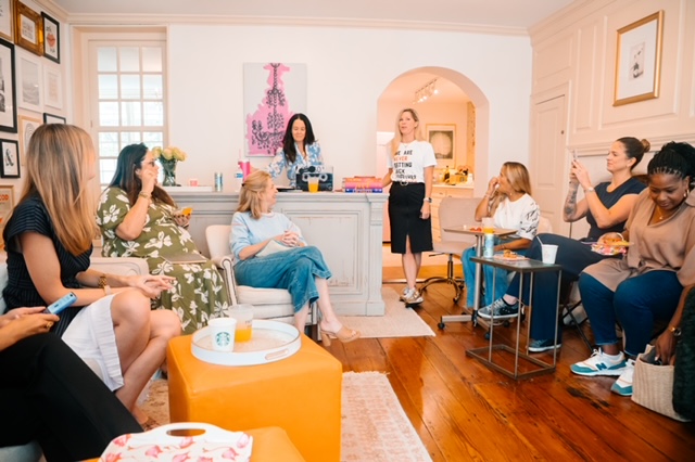 Female entrepreneurs supporting each other while overcoming imposter syndrome