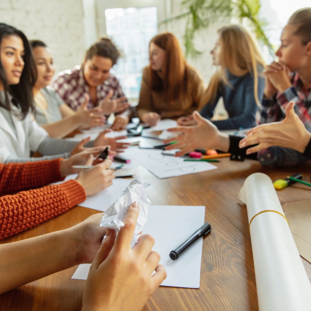 Confident female entrepreneur celebrating success after overcoming imposter syndrome
