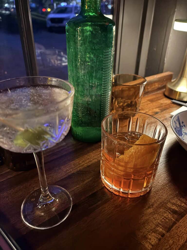 The Holmes Fashion old fashioned cocktail with Cheerwine simple syrup and cherry garnish